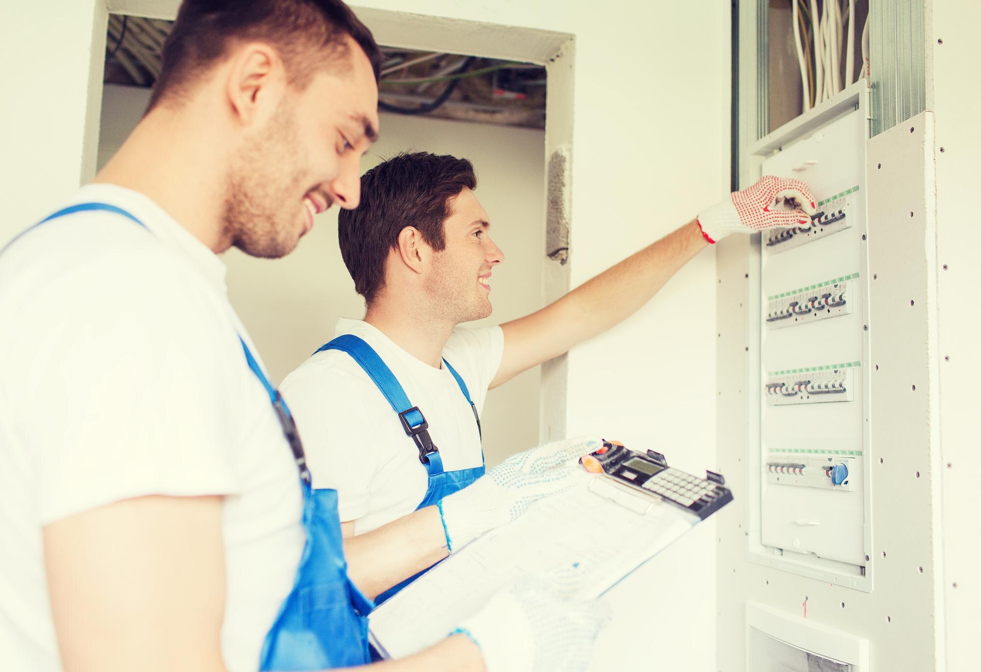 business-building-teamwork-people-concept-group-smiling-builders-with-clipboard-electrical-panel-ind.jpg